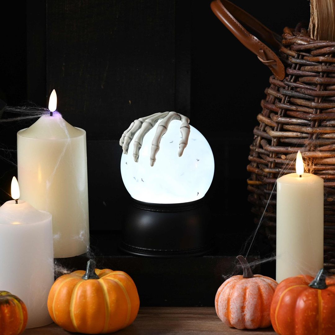 Festive 15cm Battery Operated Lit Skeleton Hand Water Globe - Image 1