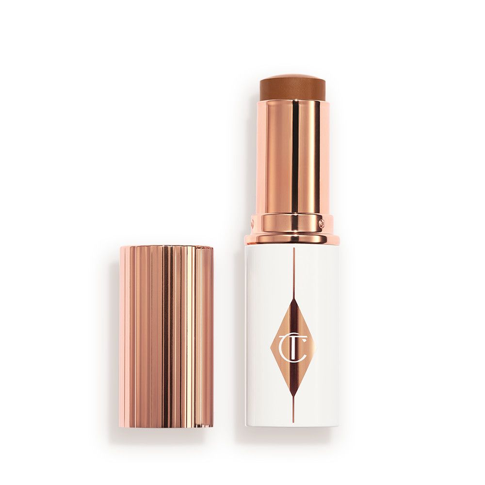 Charlotte Tilbury Unreal Skin Sheer Glow Tint Hydrating Foundation Stick - 14 Deep - Image 1