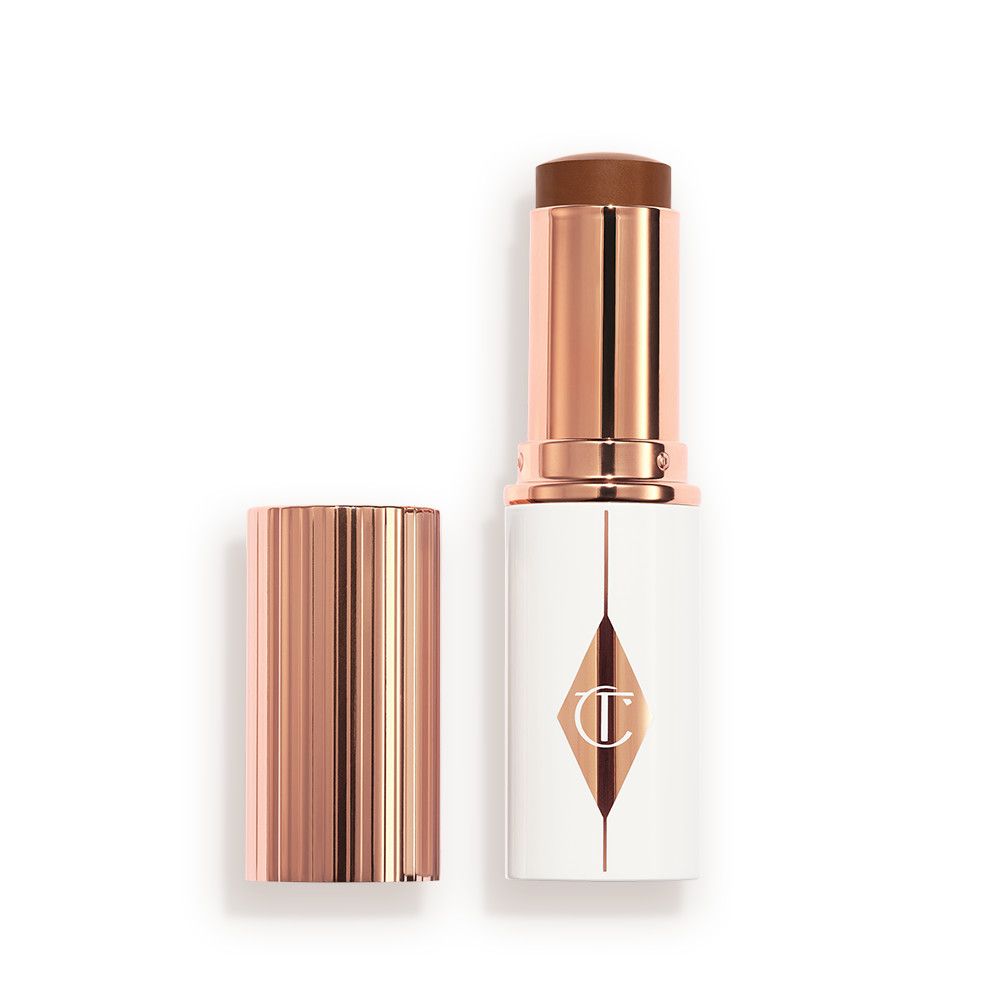 Charlotte Tilbury Unreal Skin Sheer Glow Tint Hydrating Foundation Stick - 15 Deep - Image 1