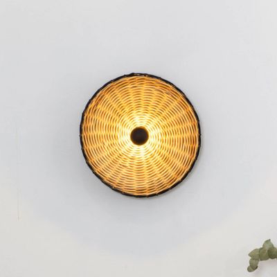 FARO BARCELONA Costas wall light, black/light wood, rattan, Ø 40 cm